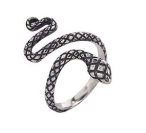  A stylish collection of fancy snake rings in gold, silver, and gemstone designs displayed on a velvet tray.